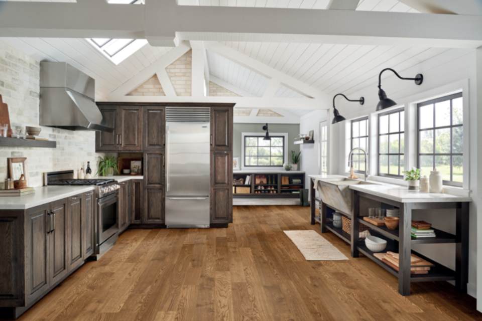 dark wood kitchen cabinets in farmhouse kitchen with white and stone accents.